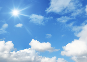 Image showing typical blue sky with sun and clouds background