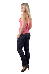 Image showing The beautiful young woman in black jeans and pink jacket. Isolat