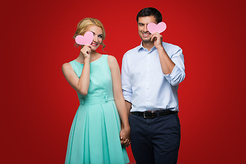 Image showing Beautiful couple holding pink hearts