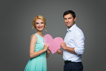 Image showing Beautiful couple holding pink heart