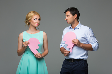 Image showing Beautiful couple holding pink broken heart