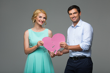 Image showing Beautiful couple holding pink broken heart