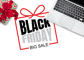 Image showing Top view of laptop and present, gift with black friday lettering on white background
