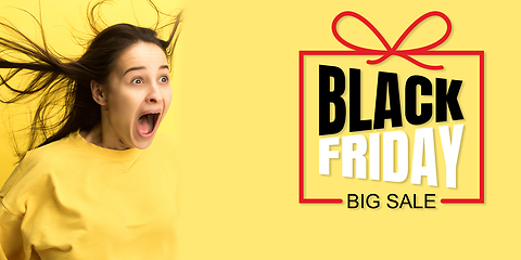 Image showing Portrait of young caucasian woman surprised and shocked of black friday