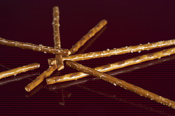 Image showing salt sticks on dark ground