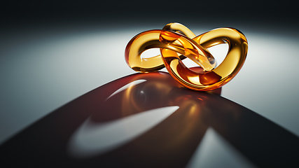 Image showing golden glass knot with light reflections