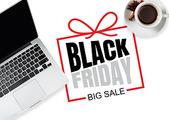 Image showing Top view of laptop and cup of tea with black friday lettering on white background