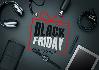 Image showing Top view of gadgets with black friday lettering on black background