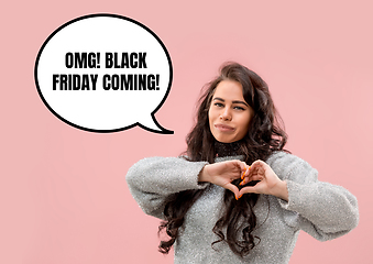 Image showing Portrait of woman showing the sign of heart black friday