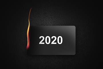 Image showing burning credit card 2020 on black background