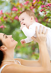 Image showing mother with baby over spring garden background