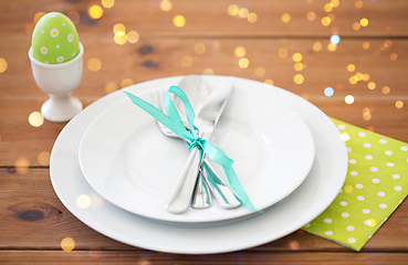 Image showing easter egg in cup holder, plates and cutlery