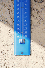 Image showing typical thermometer outside on a house wall