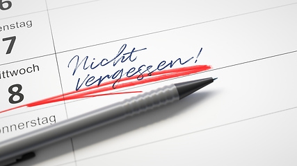 Image showing calendar with a red pen and the word do not forget in german lan