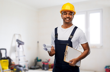 Image showing happy indian builder with blueprint and clipboard