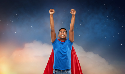 Image showing indian man in superhero cape flying in night sky