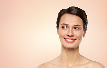 Image showing beautiful smiling young woman with bare shoulder