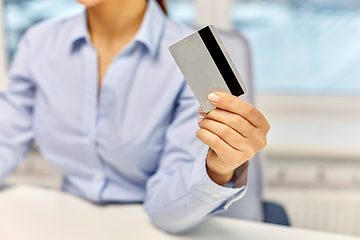 Image showing businesswoman with credit card at office