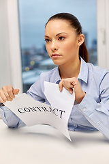 Image showing businesswoman terminating contract at office