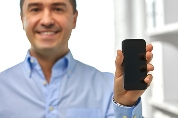 Image showing happy businessman showing smartphone screen