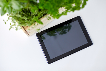 Image showing tablet computer with herbs and flowers in box