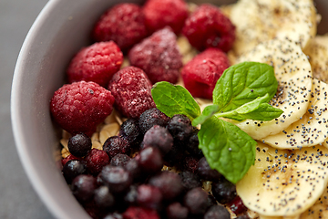 Image showing cereal breakfast with berries, banana and mint