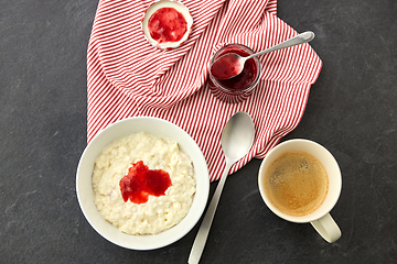 Image showing porridge breakfast with jam, spoon and coffee