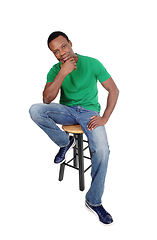 Image showing African man sitting on chair and thinking