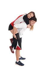 Image showing Young couple in exercise outfit do piggyback