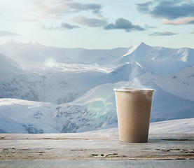 Image showing Single tea or coffee mug and landscape of mountains on background