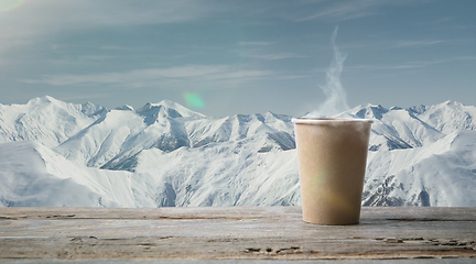 Image showing Single tea or coffee mug and landscape of mountains on background