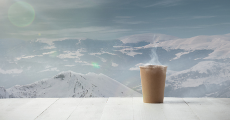 Image showing Single tea or coffee mug and landscape of mountains on background