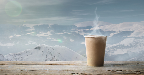 Image showing Single tea or coffee mug and landscape of mountains on background