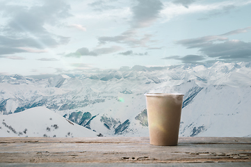 Image showing Single tea or coffee mug and landscape of mountains on background