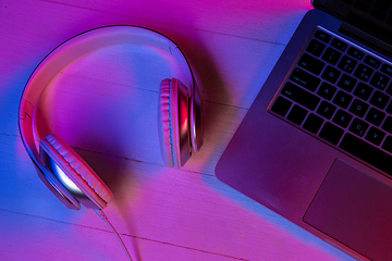 Image showing Top view of set of gadgets in purple neon light