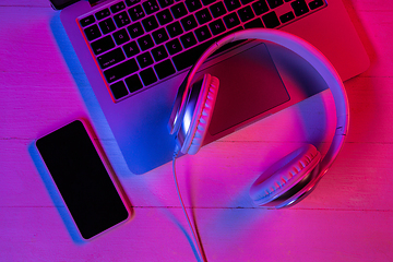 Image showing Top view of set of gadgets in purple neon light