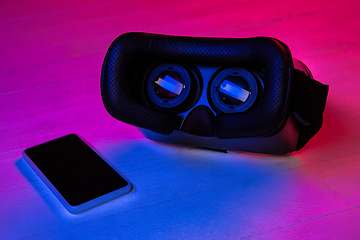 Image showing Top view of set of gadgets in purple neon light