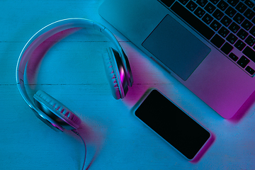 Image showing Top view of set of gadgets in purple neon light