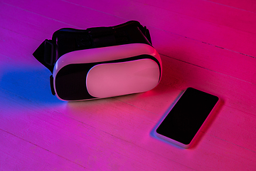 Image showing Top view of set of gadgets in purple neon light