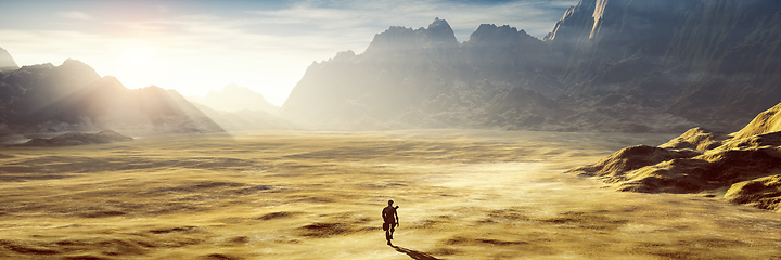 Image showing lonely man in the dry sunset desert