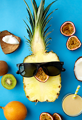 Image showing pineapple in sunglasses with other exotic fruits