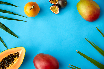 Image showing different exotic fruits on blue background