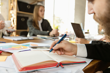 Image showing Group of young business professionals having a meeting, creative office