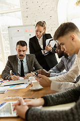 Image showing Group of young business professionals having a meeting, creative office