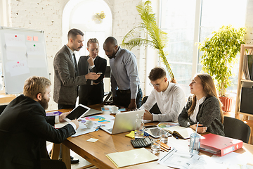 Image showing Group of young business professionals having a meeting, creative office