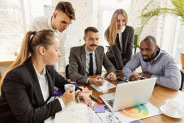 Image showing Group of young business professionals having a meeting, creative office