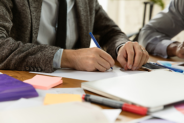 Image showing Group of young business professionals having a meeting, creative office