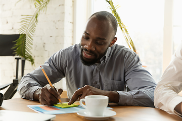 Image showing Young business professional preparing for meeting, creative office