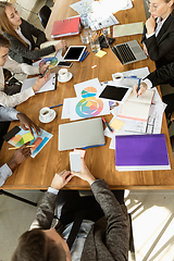 Image showing Group of young business professionals having a meeting, creative office