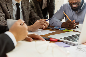 Image showing Group of young business professionals having a meeting, creative office